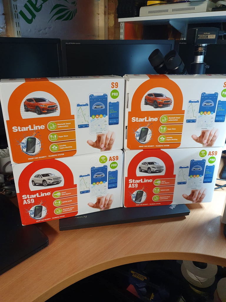 Four StarLine S9 and AS9 vehicle alarm system boxes at Revelectronics