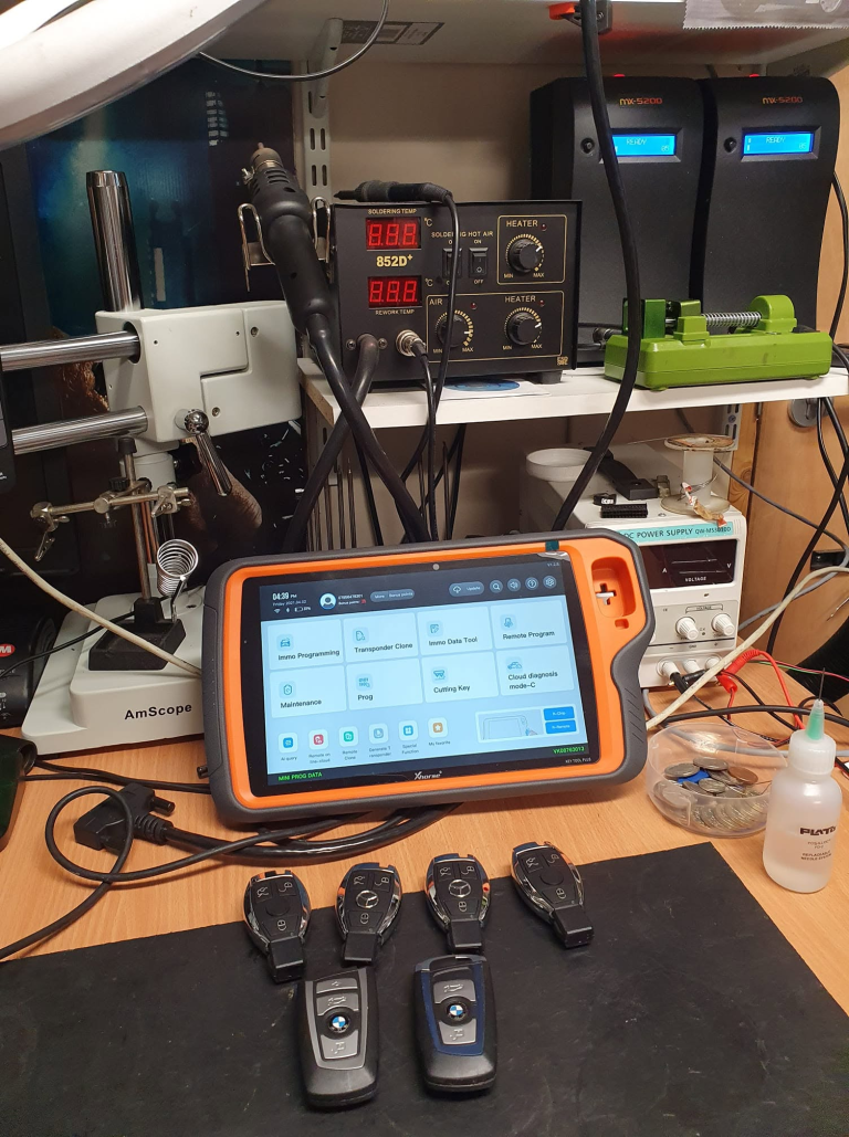 Vehicle key programming equipment and car keys on the workbench
